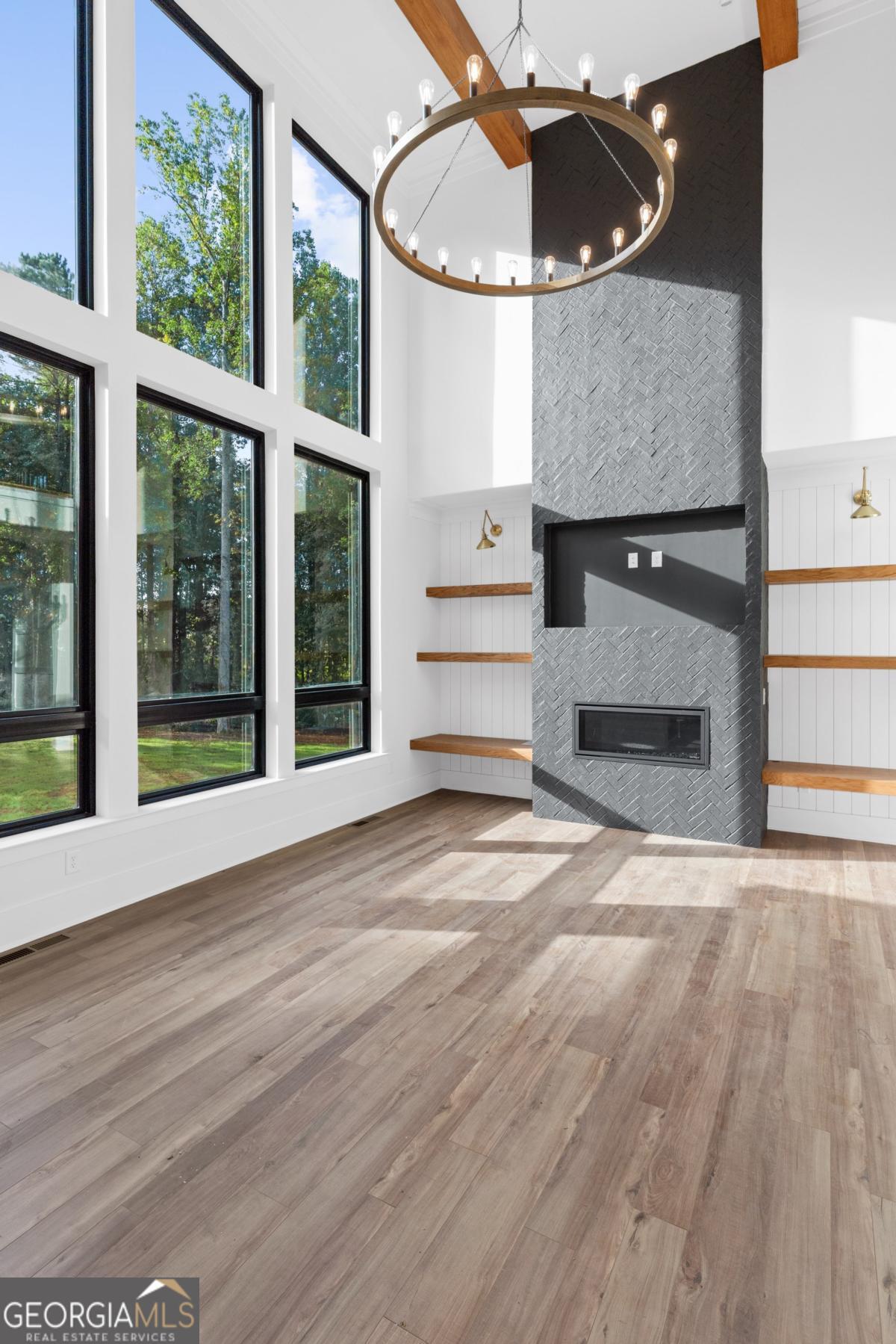 3 Cox Road Roswell, GA 30188 - Photo 12 of 37 a view of a livingroom with wooden floor and a fireplace