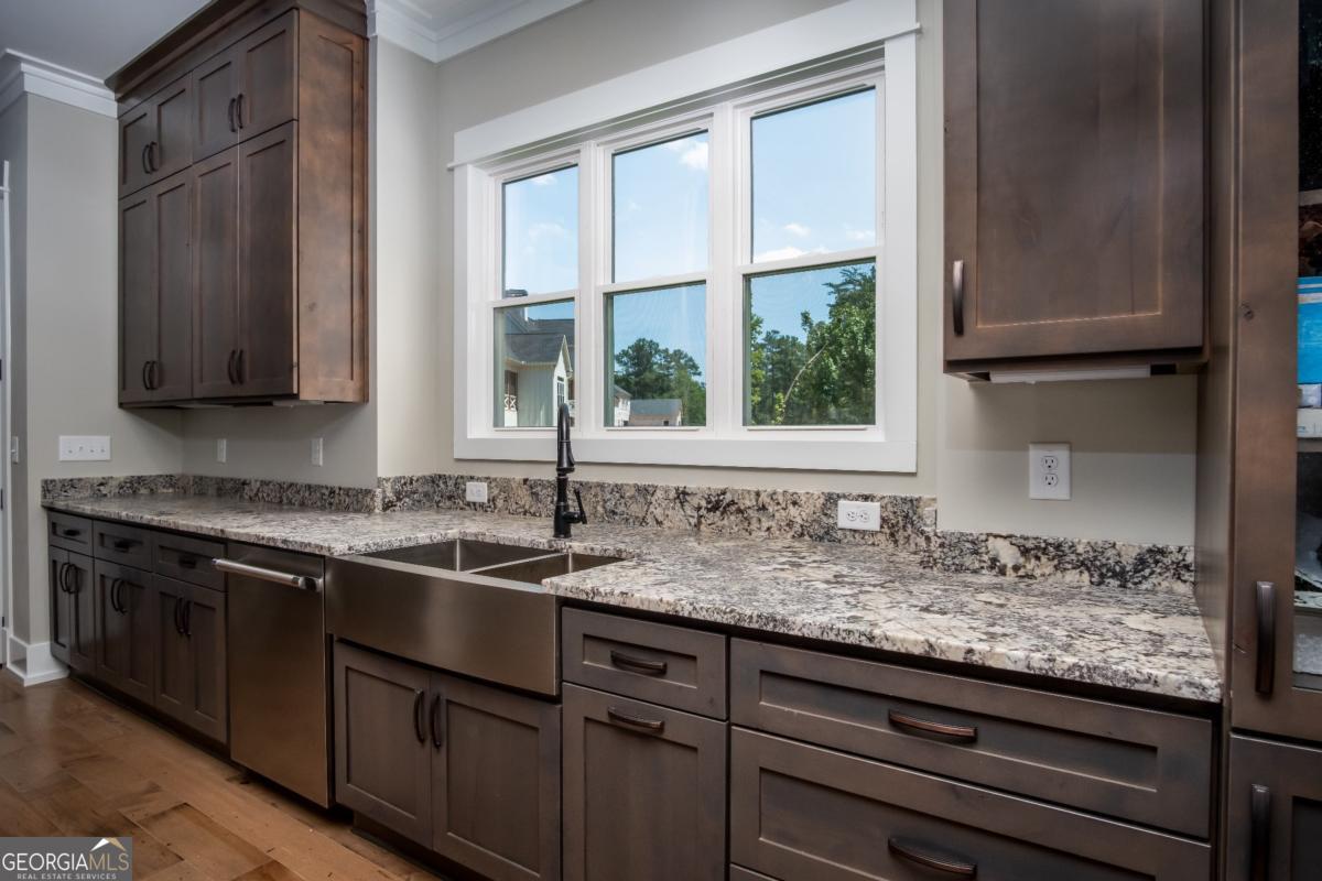 3 Cox Road Roswell, GA 30188 - Photo 20 of 38 a kitchen with granite countertop a sink and a window