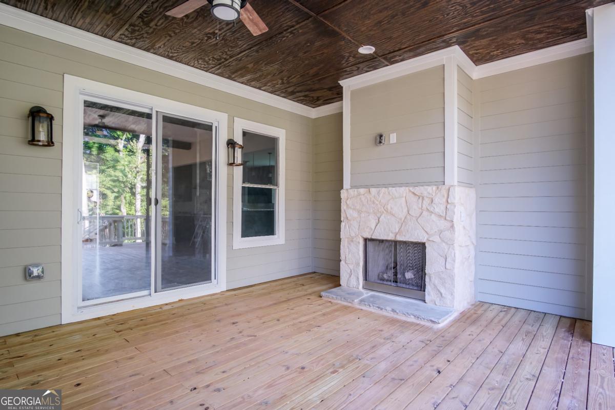 3 Cox Road Roswell, GA 30188 - Photo 21 of 38 a view of empty room with wooden floor and fireplace
