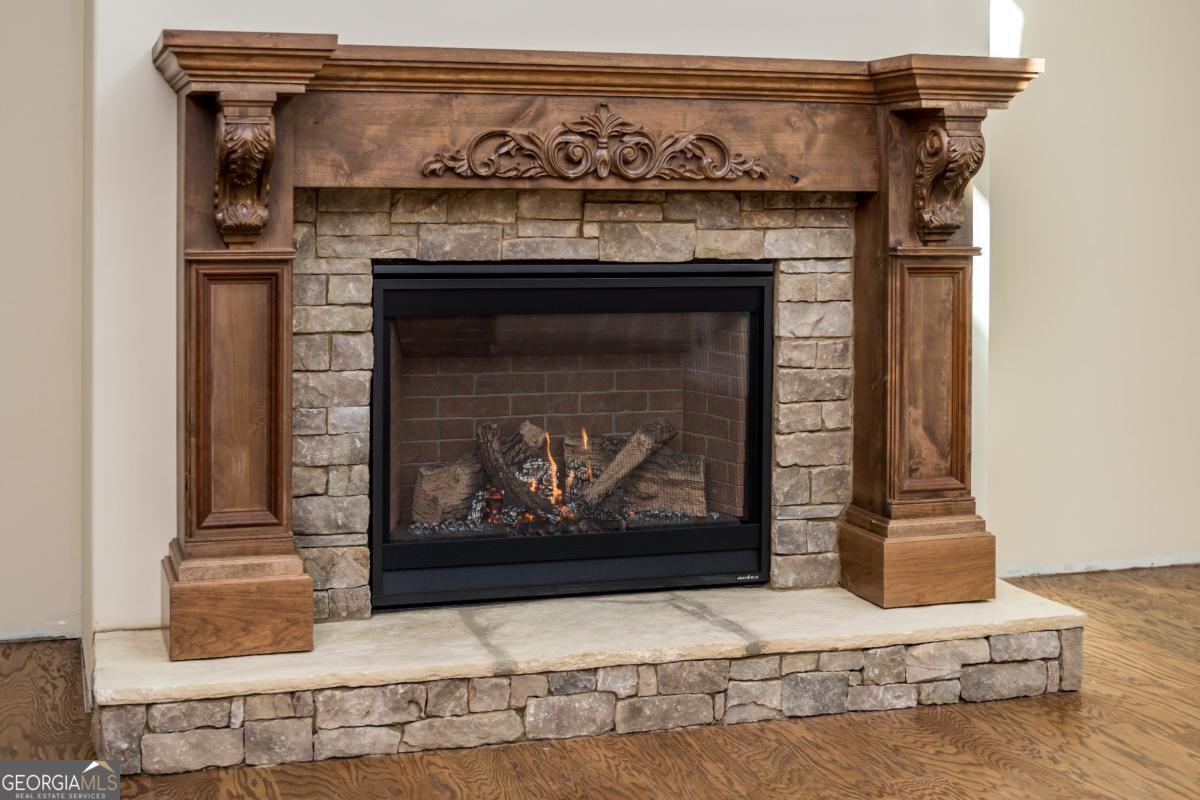 3 Cox Road Roswell, GA 30188 - Photo 37 of 38 a fireplace with a vase on top of it