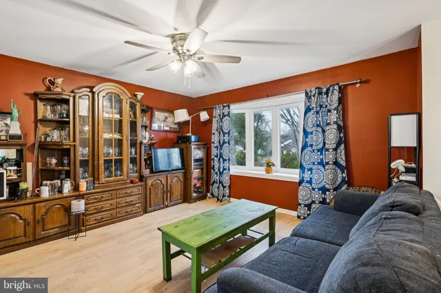 a living room with furniture a large window with outer view