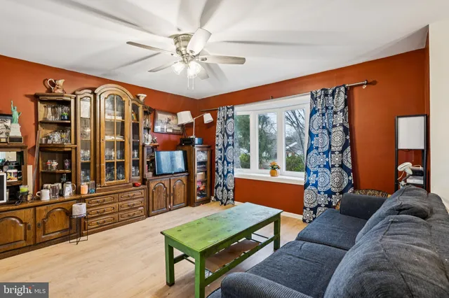 a living room with furniture a large window with outer view
