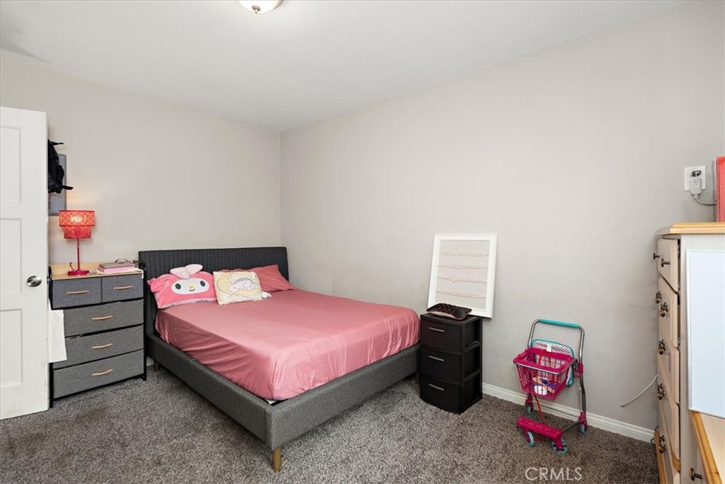 583 West Gray Street Colton, CA 92324 - Photo 14 of 22 a bedroom with a bed and a closet