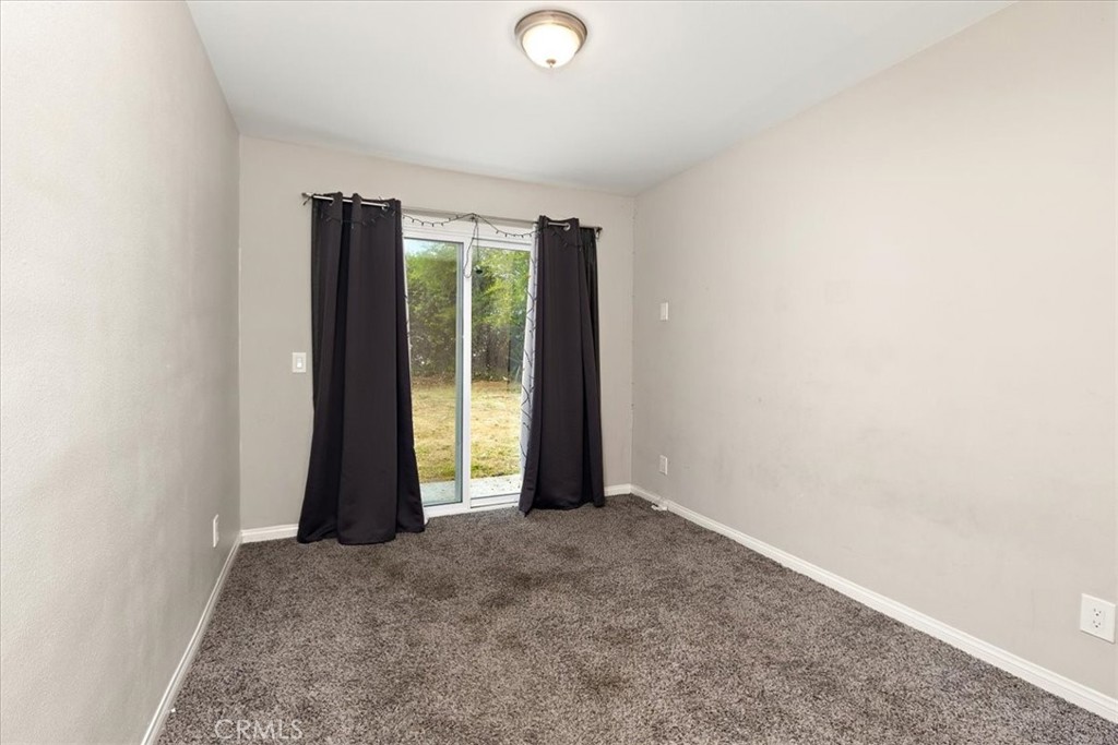 583 West Gray Street Colton, CA 92324 - Photo 18 of 22 an empty room with yard and a window