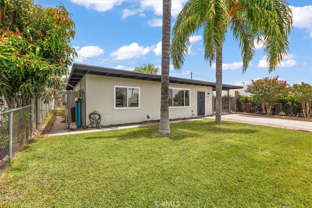 583 West Gray Street Colton, CA 92324 - Photo 3 of 22 a swimming pool with an outdoor space and seating area