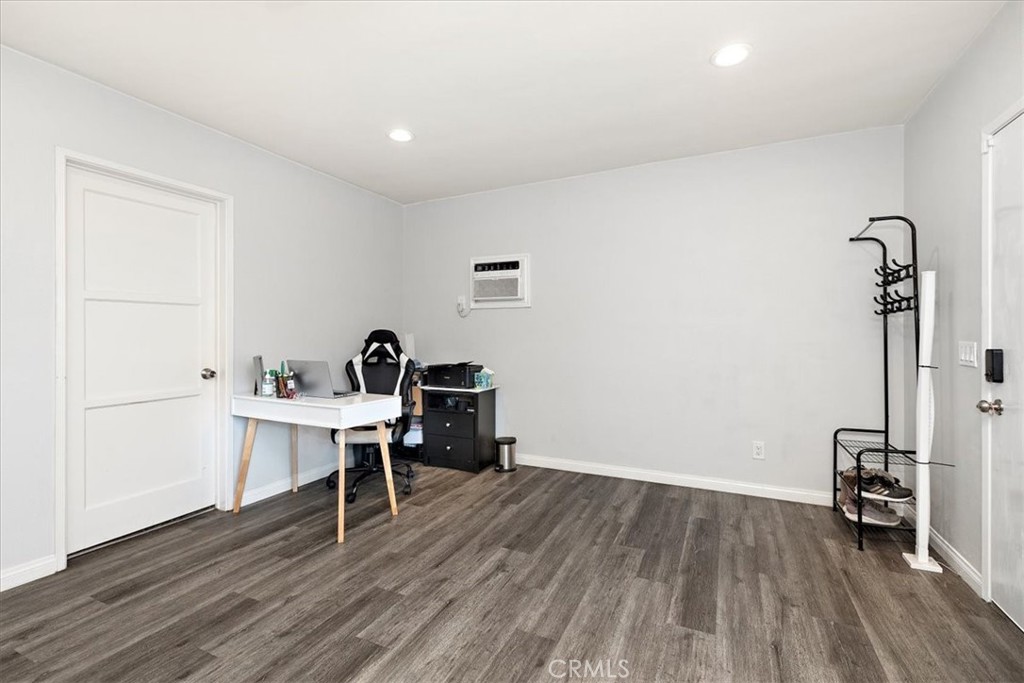 583 West Gray Street Colton, CA 92324 - Photo 8 of 22 a view of a workspace with wooden floor