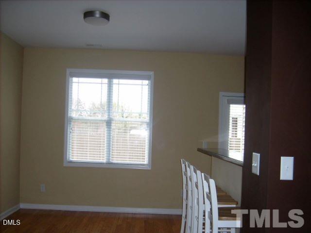 5109 Powell Townes Way Raleigh, NC 27606 - Photo 3 of 7 a view of an empty room with a window