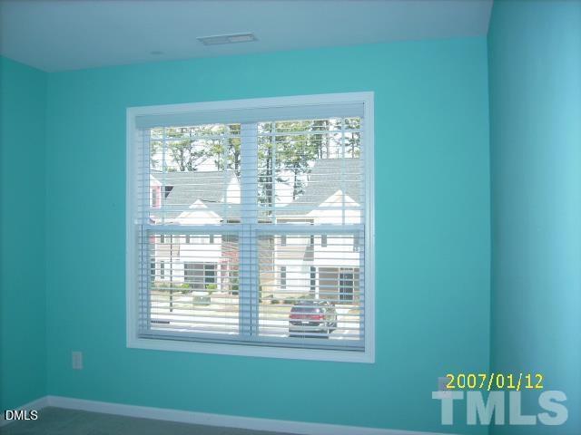 5109 Powell Townes Way Raleigh, NC 27606 - Photo 4 of 7 a view of a room that has a window