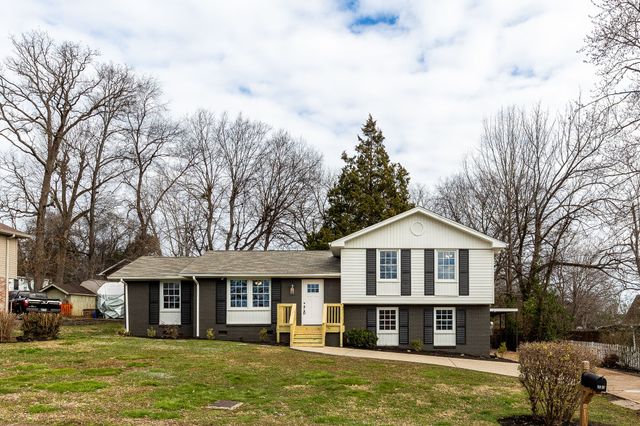 a front view of a house with a large pool