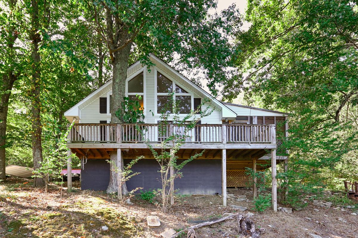 741 Lake Logan Road Ardmore, TN 38449 - Photo 1 of 13 a front view of a house with yard porch and seating space