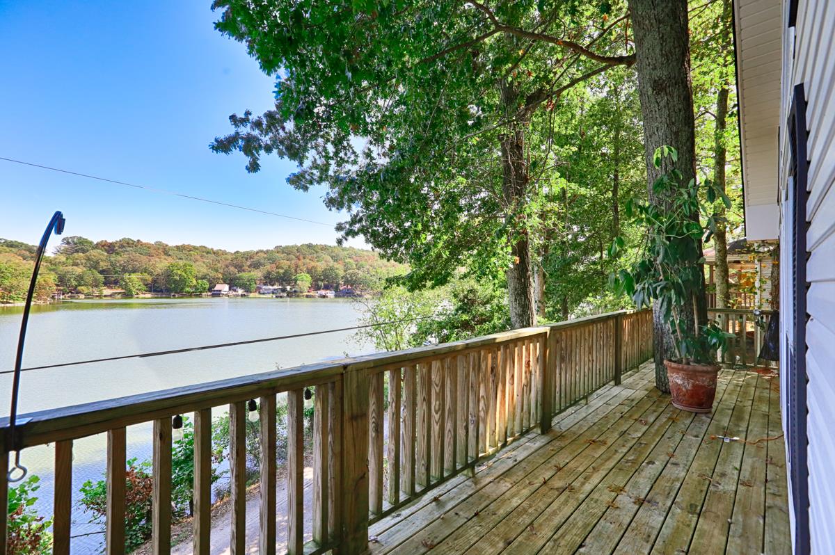 741 Lake Logan Road Ardmore, TN 38449 - Photo 6 of 13 a view of a balcony with wooden floor