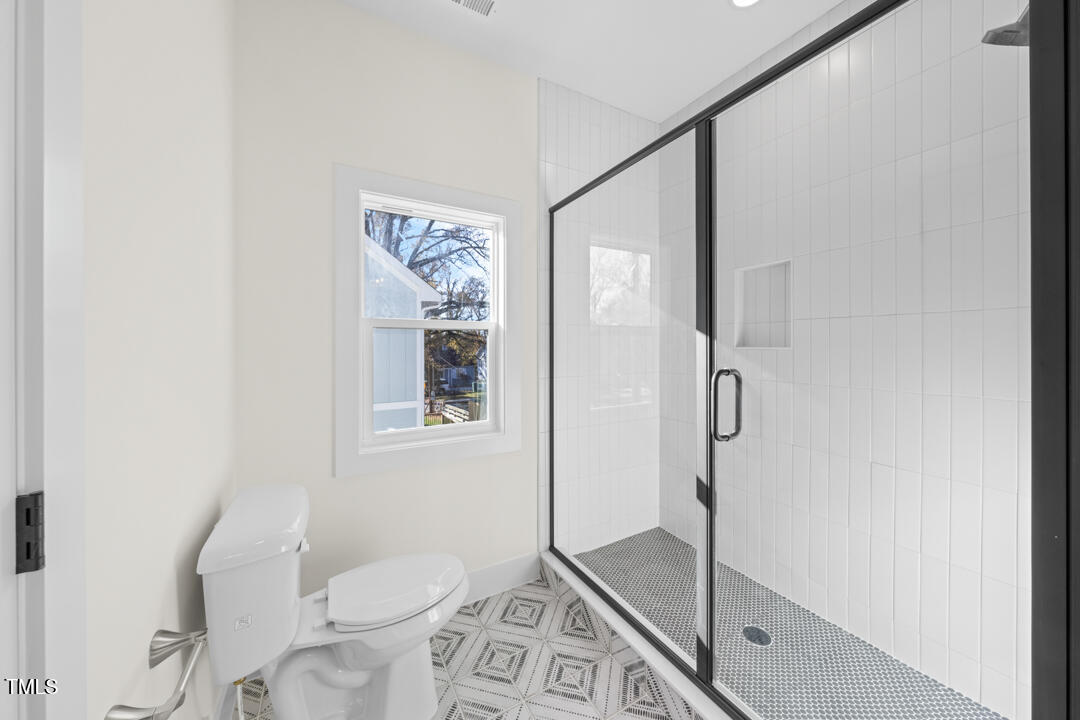 2503 Lednum Street Durham, NC 27704 - Photo 20 of 25 a bathroom with a toilet sink and shower
