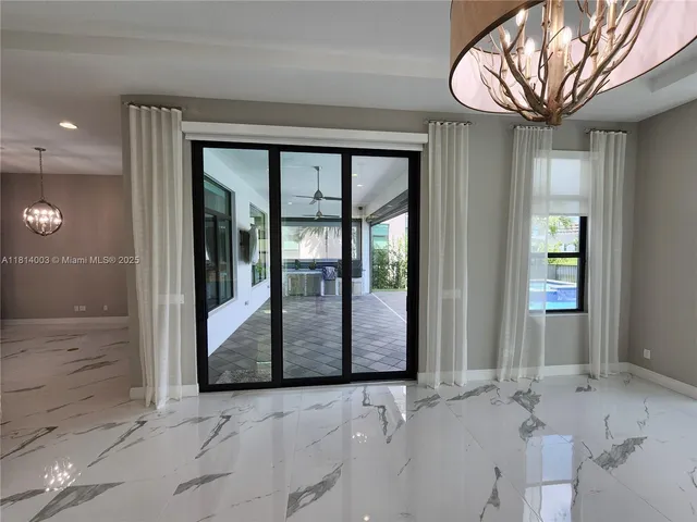a large bathroom with a large tub and sink