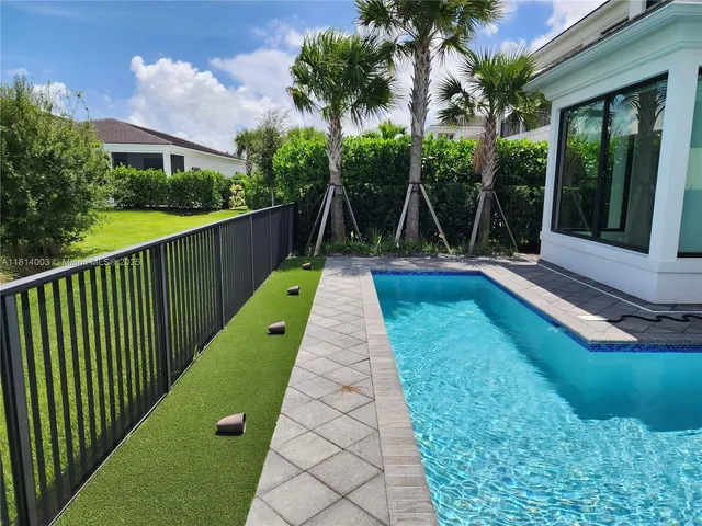 a open kitchen with stainless steel appliances granite countertop a stove a sink and a refrigerator