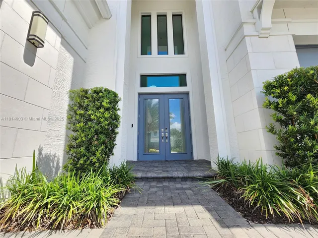 a view of hallway with wooden floor and window
