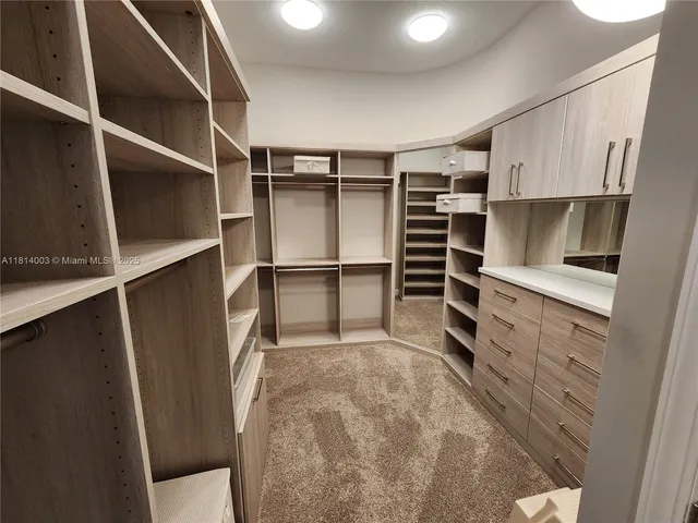 a bathroom with a granite countertop sink mirror and shower