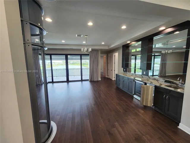 a view of two chairs in the patio