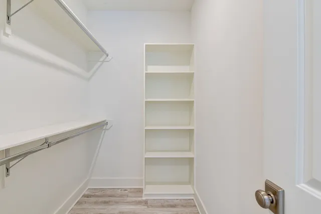 a view of an empty walk in closet