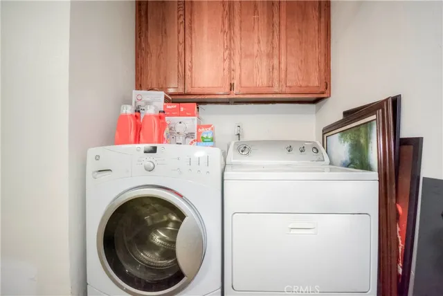 a bathroom with a sink vanity mirror and toilet
