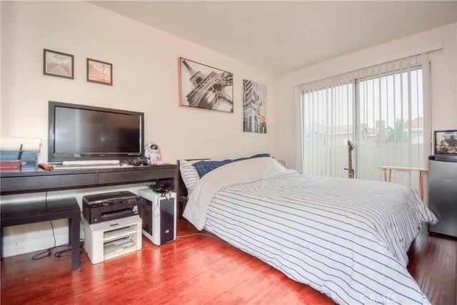a bathroom with a granite countertop sink mirror and toilet