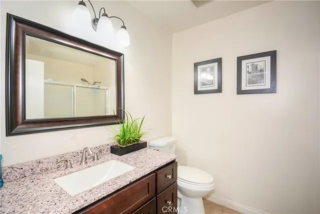 a bedroom with bed and a window