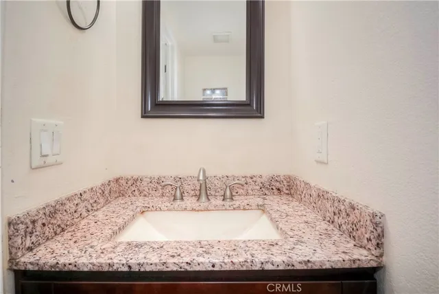 a kitchen with a sink and a refrigerator