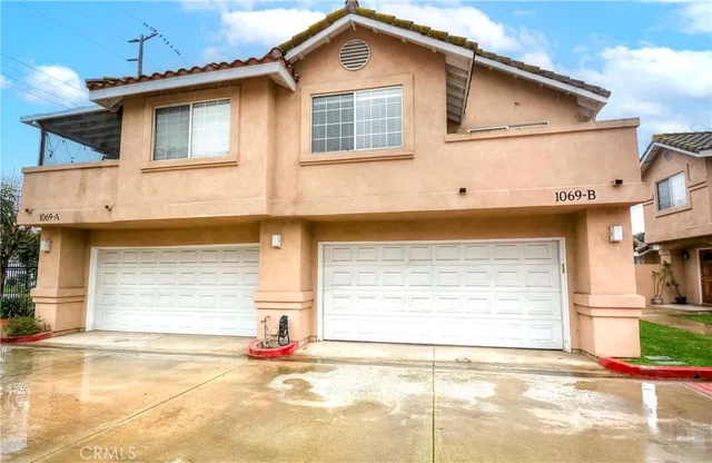 a front view of a house with a garage
