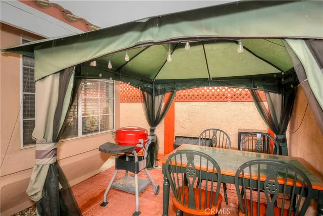 a view of balcony with two chairs and a umbrella