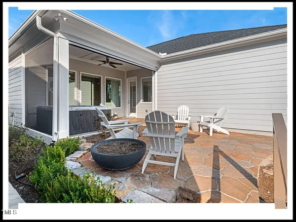 a view of a swimming pool with a patio and a garden