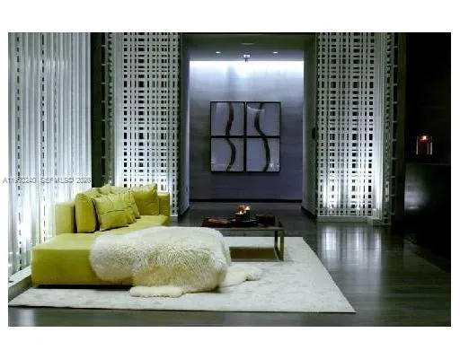 a living room with furniture and a lamp