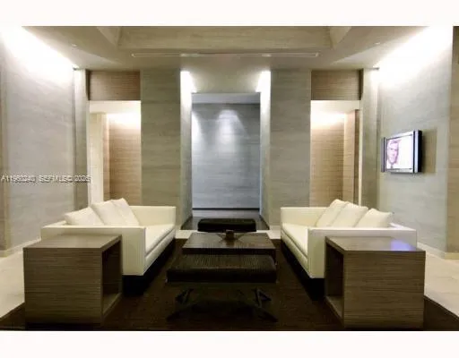 a bathroom with a sink a toilet a mirror and bathtub