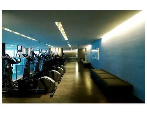 a room with lots of gym equipment