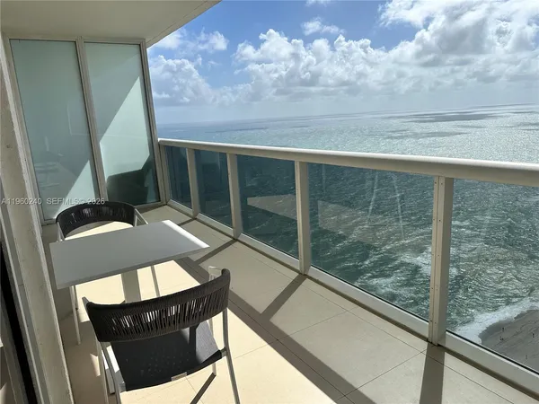 a view of balcony with furniture