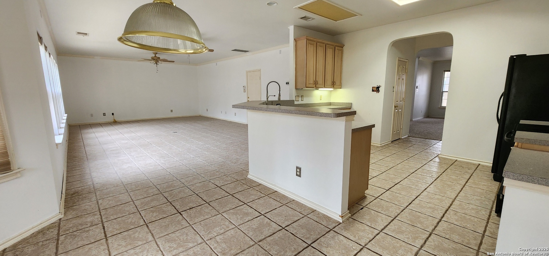 9318 Grand Cedar Helotes, TX 78023 - Photo 14 of 32 a view of kitchen with refrigerator and cabinets