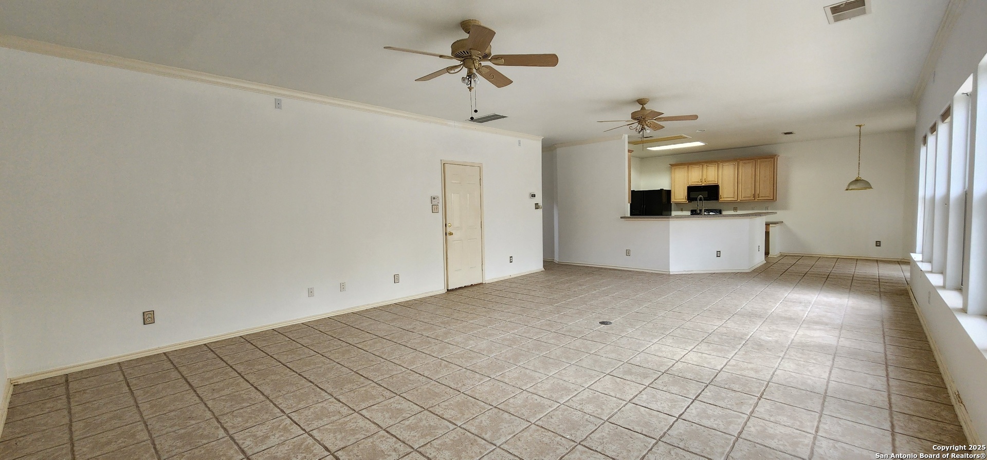 9318 Grand Cedar Helotes, TX 78023 - Photo 15 of 32 a view of a kitchen with a sink and a window