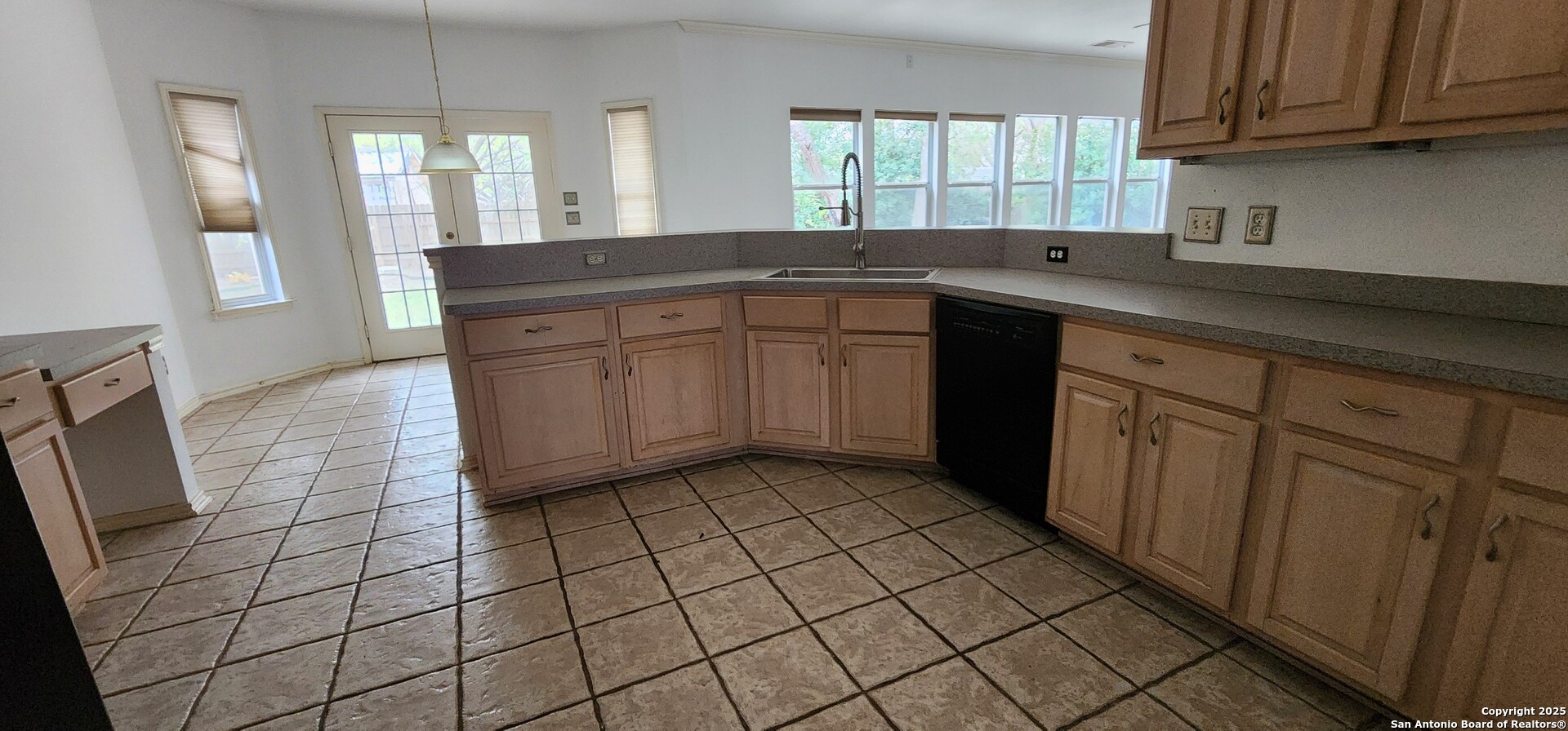 9318 Grand Cedar Helotes, TX 78023 - Photo 17 of 32 a kitchen with stainless steel appliances a sink stove and cabinets