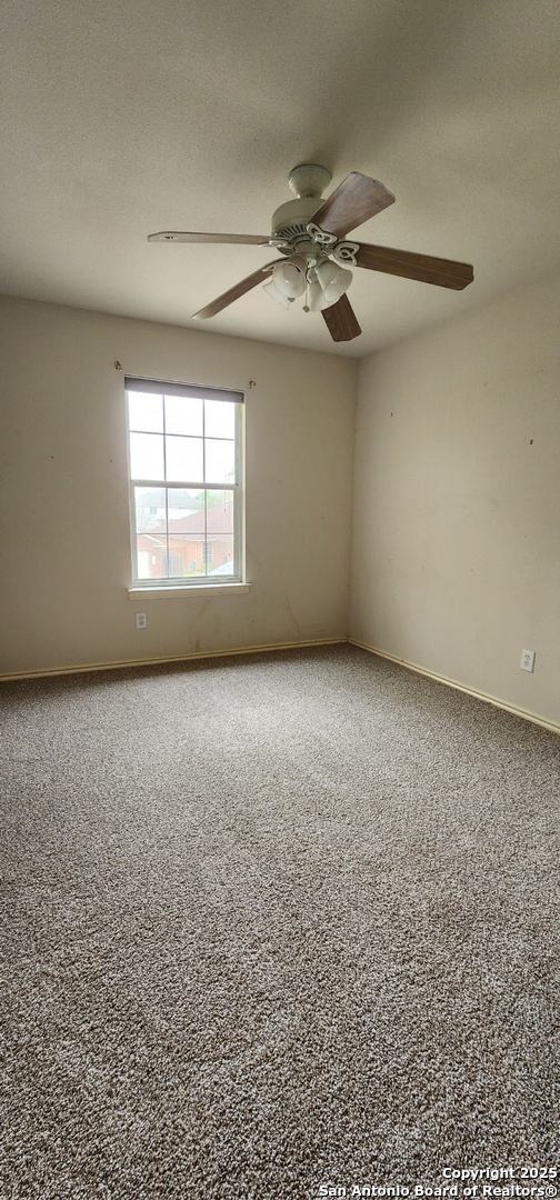 9318 Grand Cedar Helotes, TX 78023 - Photo 19 of 32 an empty room with a empty space and windows