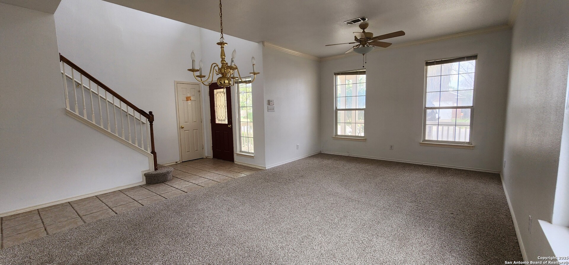 9318 Grand Cedar Helotes, TX 78023 - Photo 10 of 32 a view of a livingroom with a ceiling fan and window