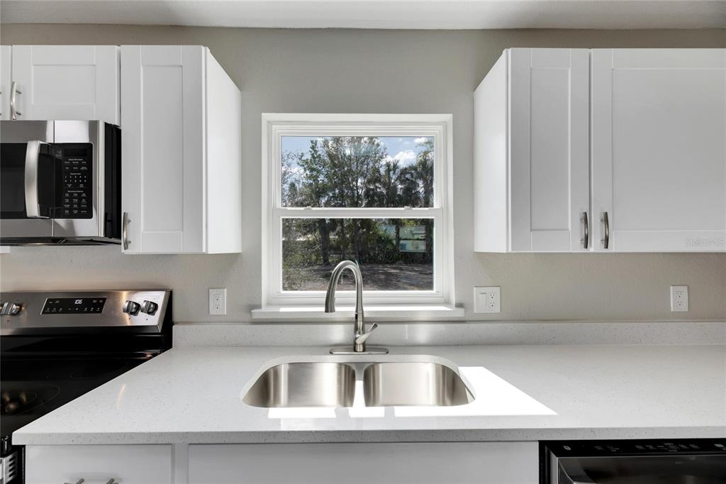 660 Flamingo Drive Apollo Beach, FL 33572 - Photo 20 of 63 a kitchen with a sink and a window