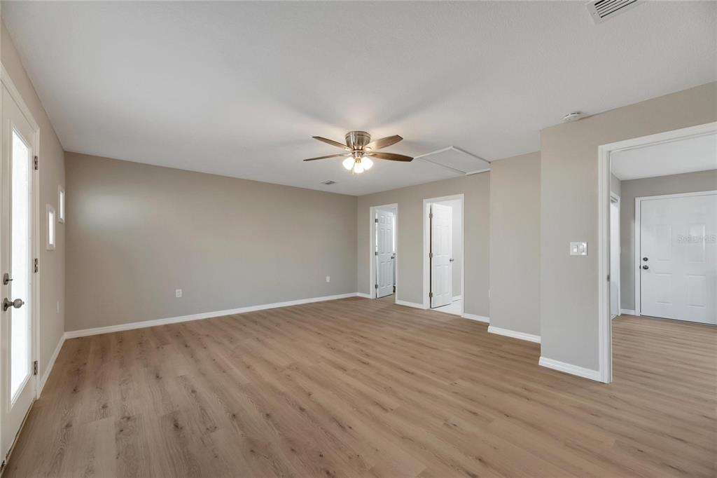 660 Flamingo Drive Apollo Beach, FL 33572 - Photo 25 of 63 a view of an empty room with wooden floor
