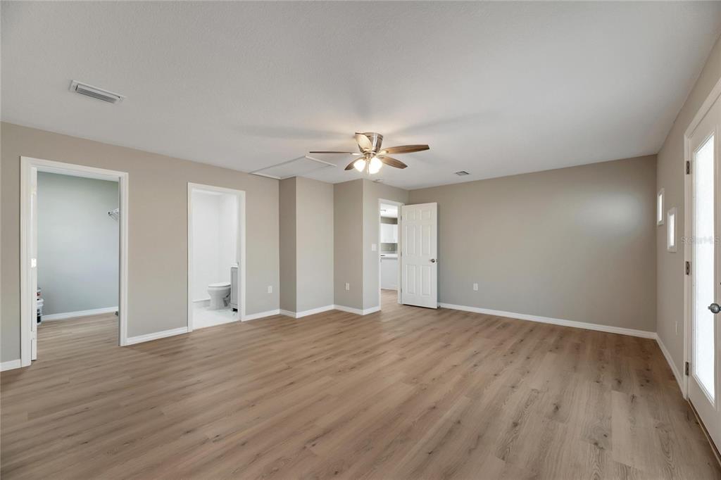660 Flamingo Drive Apollo Beach, FL 33572 - Photo 26 of 63 a view of an empty room with wooden floor