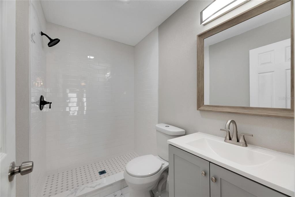 660 Flamingo Drive Apollo Beach, FL 33572 - Photo 29 of 63 a bathroom with a sink toilet and shower
