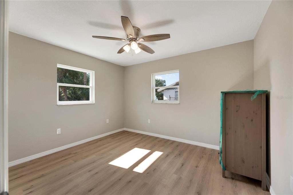660 Flamingo Drive Apollo Beach, FL 33572 - Photo 37 of 63 a view of empty room with wooden floor and fan