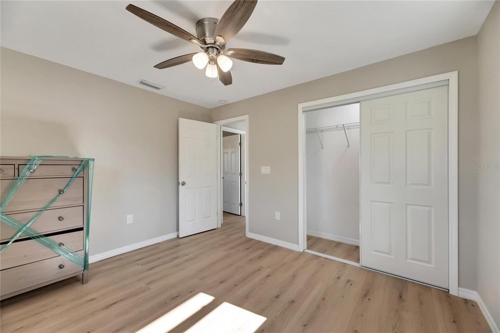 660 Flamingo Drive Apollo Beach, FL 33572 - Photo 38 of 63 wooden floor in an empty room with a window