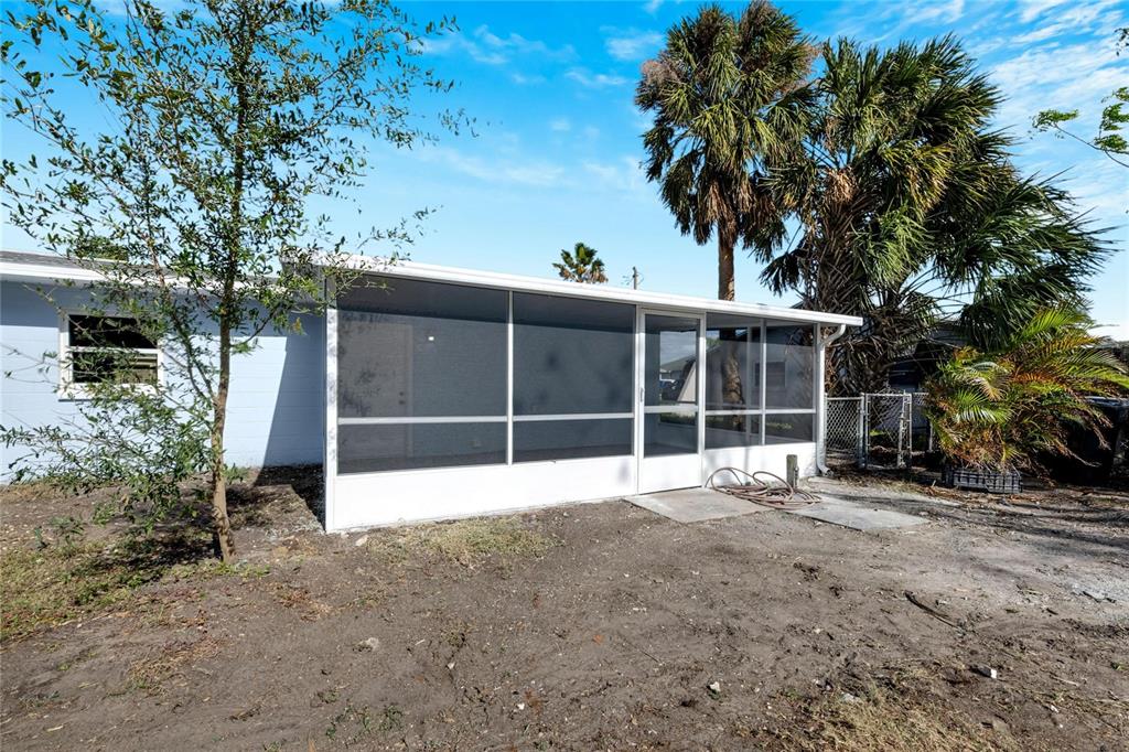 660 Flamingo Drive Apollo Beach, FL 33572 - Photo 44 of 63 a view of a house with a yard and garage