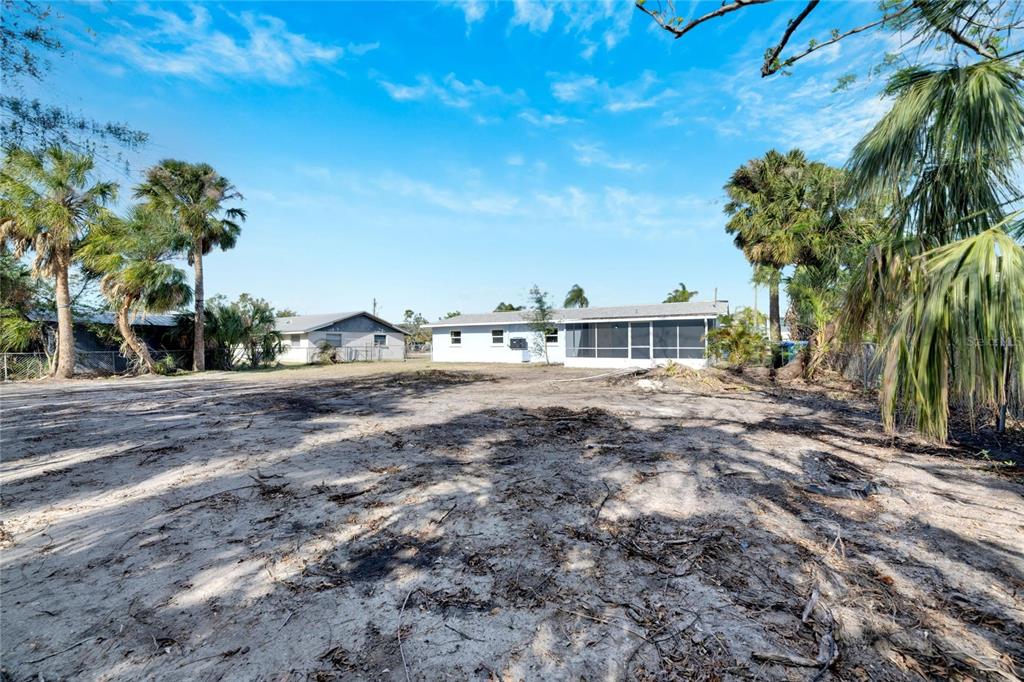 660 Flamingo Drive Apollo Beach, FL 33572 - Photo 45 of 63 a view of house with outdoor space and trees