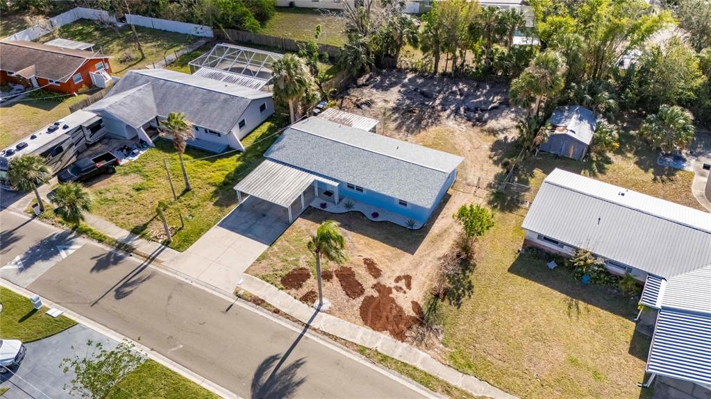 660 Flamingo Drive Apollo Beach, FL 33572 - Photo 54 of 63 an aerial view of a house with a yard