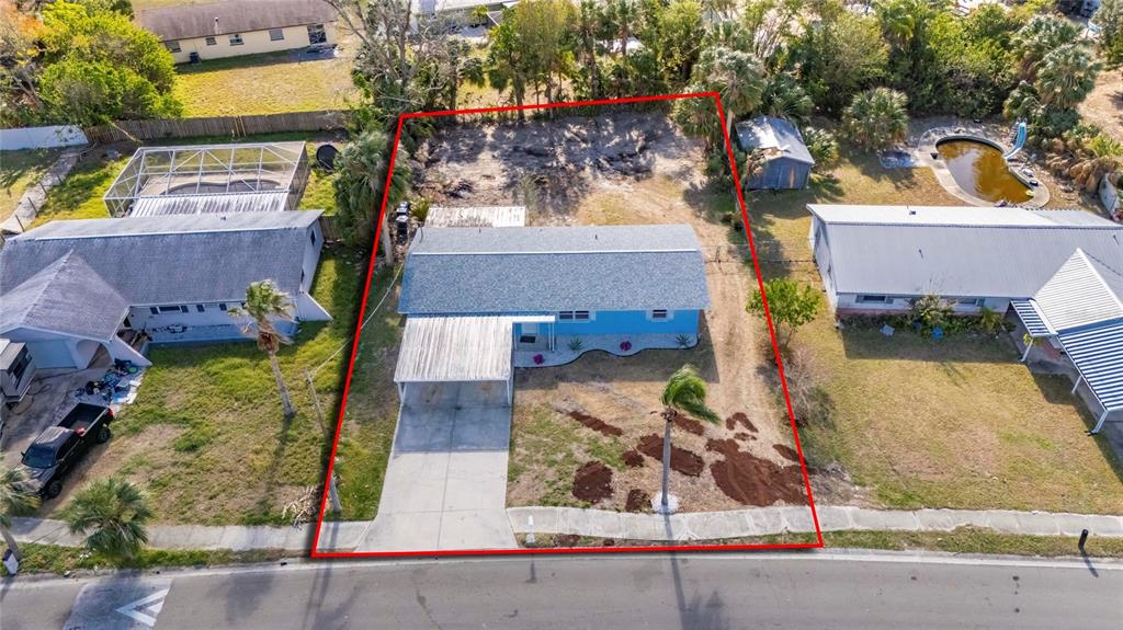 660 Flamingo Drive Apollo Beach, FL 33572 - Photo 55 of 63 an aerial view of a house with a swimming pool