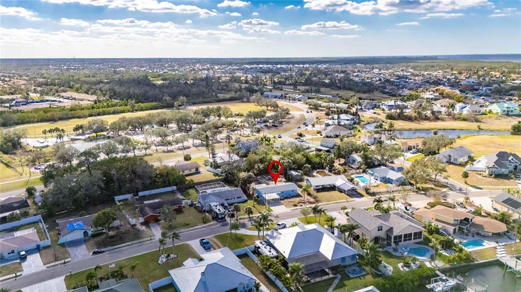 660 Flamingo Drive Apollo Beach, FL 33572 - Photo 59 of 63 an aerial view of residential houses with outdoor space
