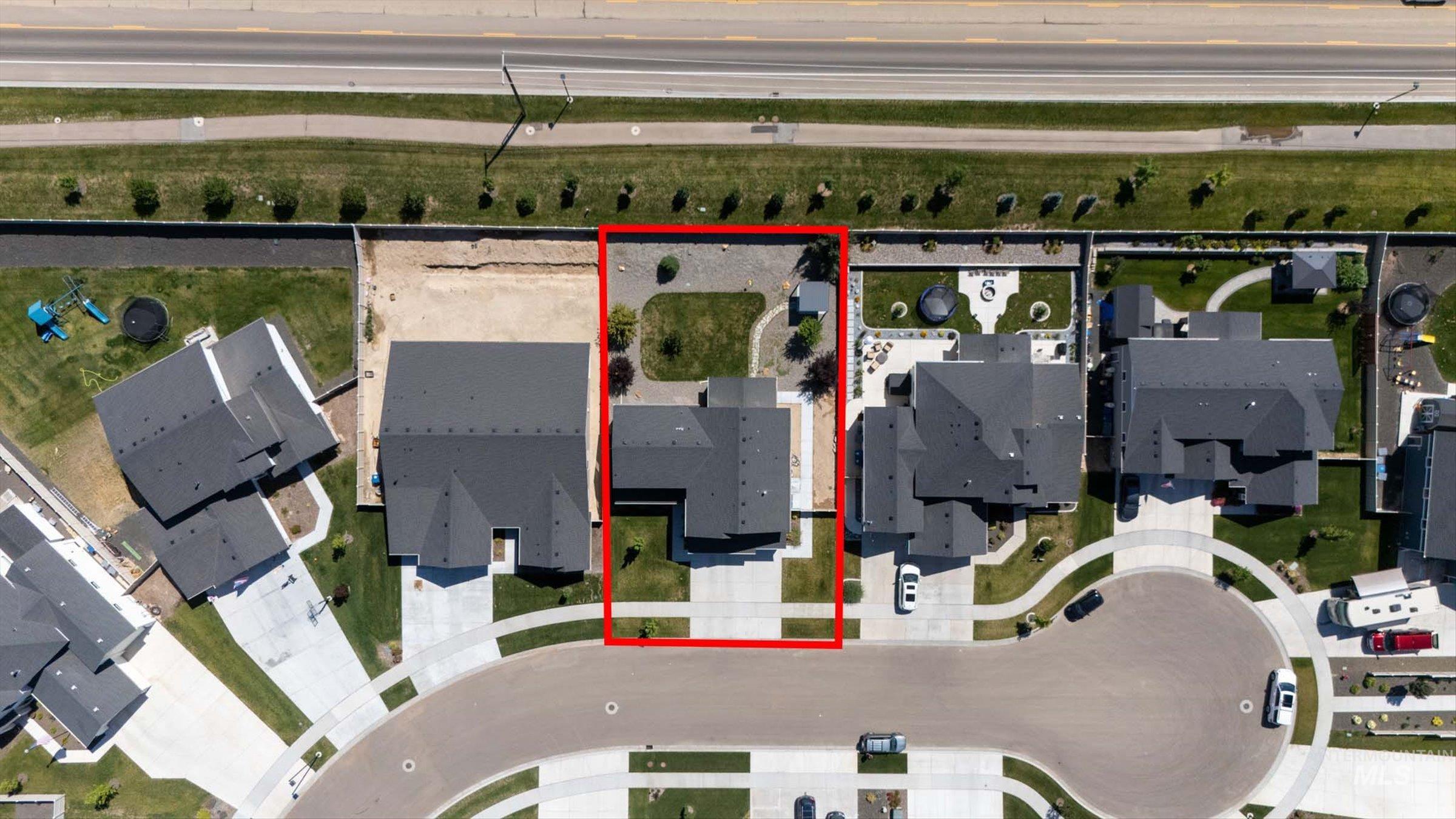 2172 Savoy Court Middleton, ID 83644 - Photo 46 of 46 Aerial view of a residential property with a dark-pitched roofline and light-colored siding